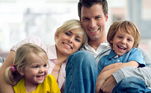 Young Family Sitting on a Couch