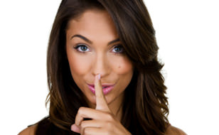 Woman Holding Finger to Her Mouth