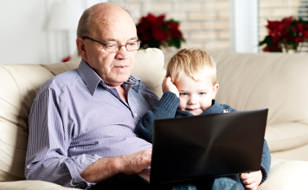 Grandfather and Grandson on Laptop