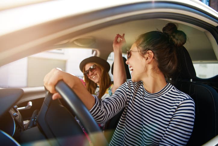 People singing in a car