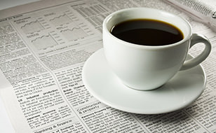 Coffee Cup on Newspaper