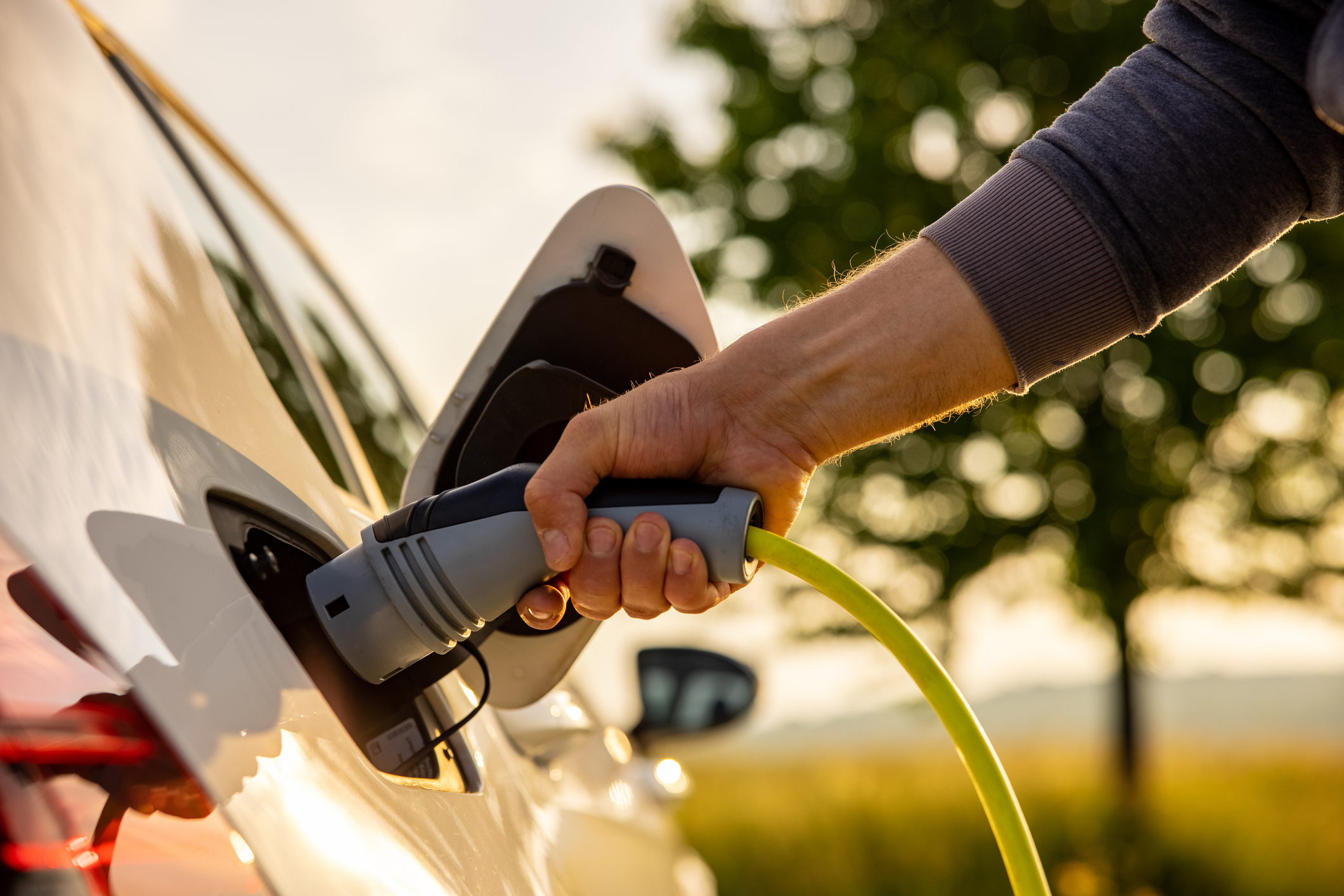 Man charging EV car