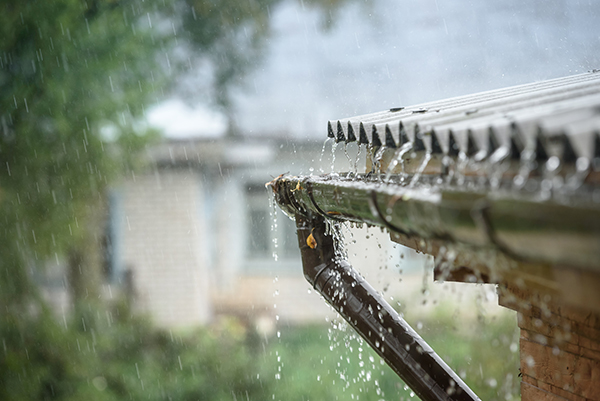 Storm rainwater overflowing a gutter