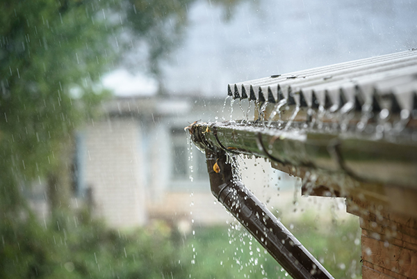 Storm rainwater overflowing a gutter