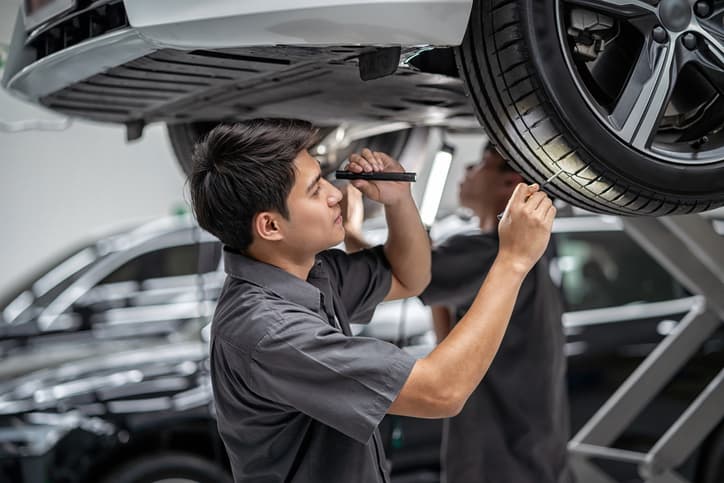 Motor Mechanic Working On A Car With Chill Insurance 