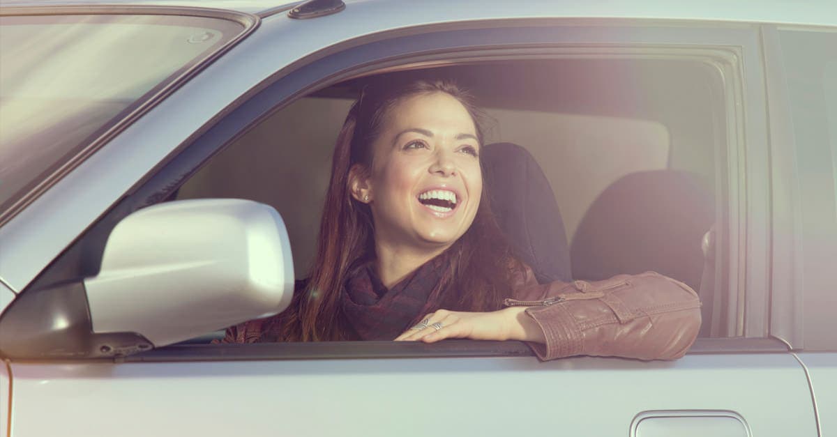 Smiling Woman In Her Car 