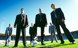 Business Men on a Football Pitch