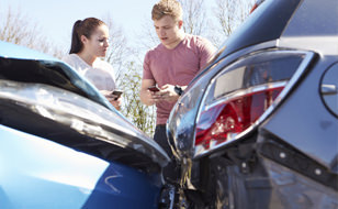 People Discussing Car Details And Liability At A Car Accident