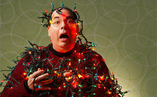 Man Demonstrating Dangers Of Christmas Lights