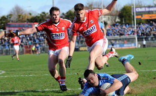 Cork Player Tackling Dublin Player