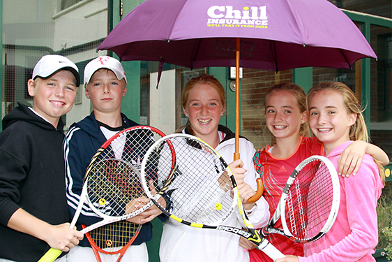 east-of-ireland-tennis-players-under-umbrella