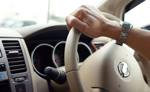 Hand on Steering Wheel
