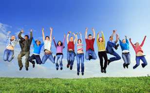 Group of People Jumping in a Field