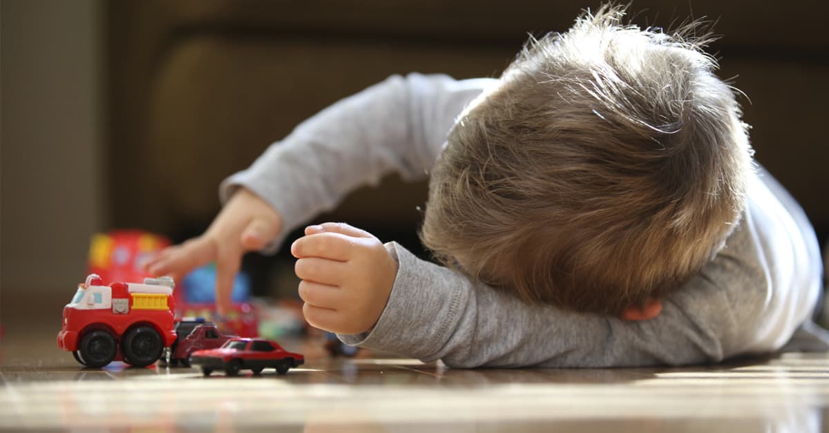 child-playing-with-car-that-needs-breakdown-assistance