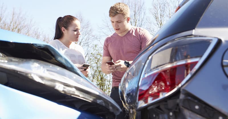 People Exchanging Contact Numbers At Scene Of An Accident