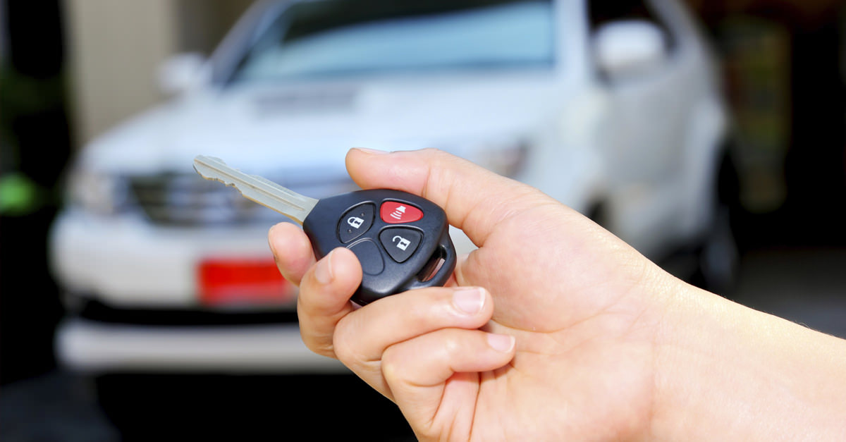 man-activating-car-alarm-via-key-fob