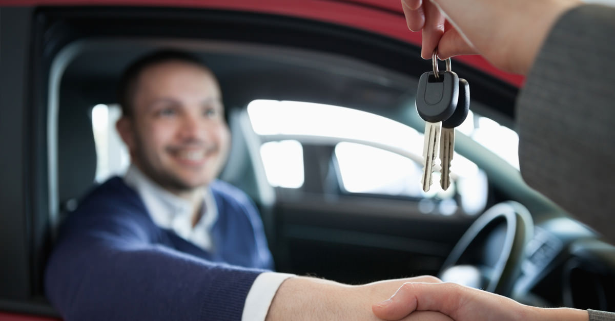 Man Accepting New Car Keys