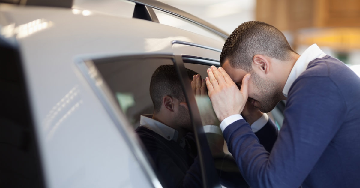 Man Peering Through Car Window