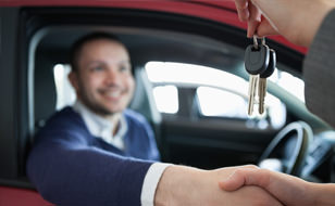 Man Holding Car Keys