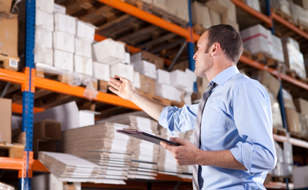 Man Auditing a Warehouse