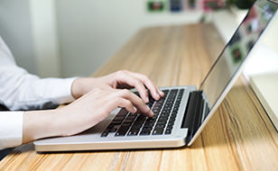 Person Browsing Chill Insurance Business Insurance On Her Laptop