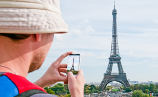 Man Photographing Eiffel Tower