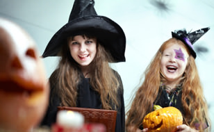 Two Girls Dressed in Halloween Costumes