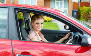 Woman Sitting in Red Car
