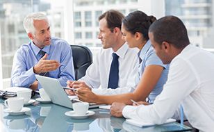 Business Man With Professional Indemnity Cover From Chill Insurance Offer Advice To A Company