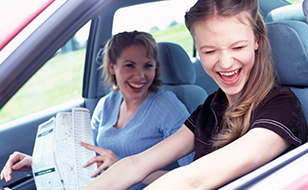 Mom and daughter driving