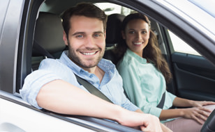 Couple Driving Happily Because They Used Chill Insurance To Compare Car Insurance Quotes