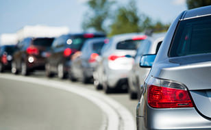 Customer With Car Insurance From Chill Insurance Stuck In A Traffic Jam