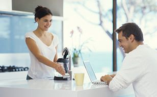 Young Couple smiling after covering their house with Chill home insurance