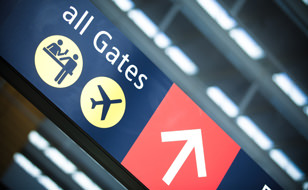 All Gates Sign In An Airport Indicating Directions For People Who May Have Travel Insurance From Chill Insurance 