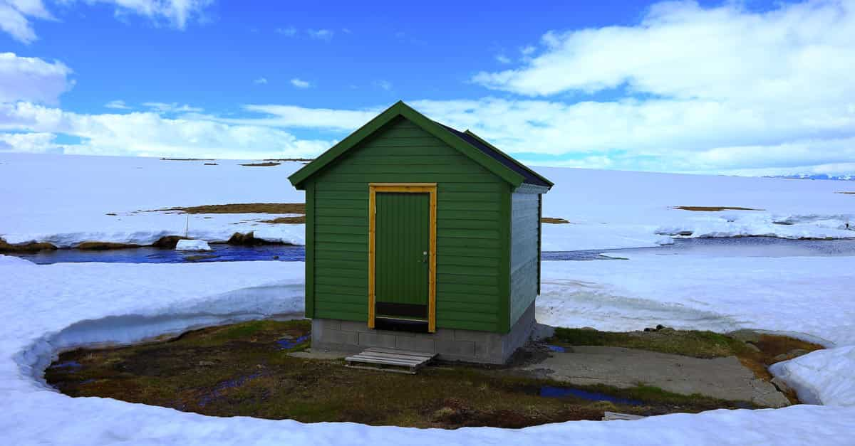 Green House Isolated In The Snow