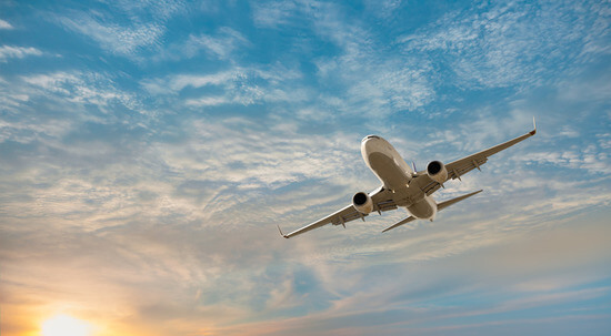 Plane over tropical sea