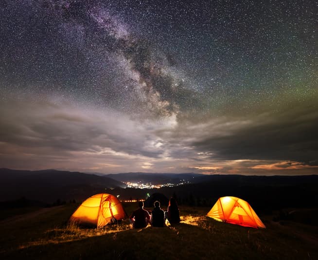 tents on hill under the stars
